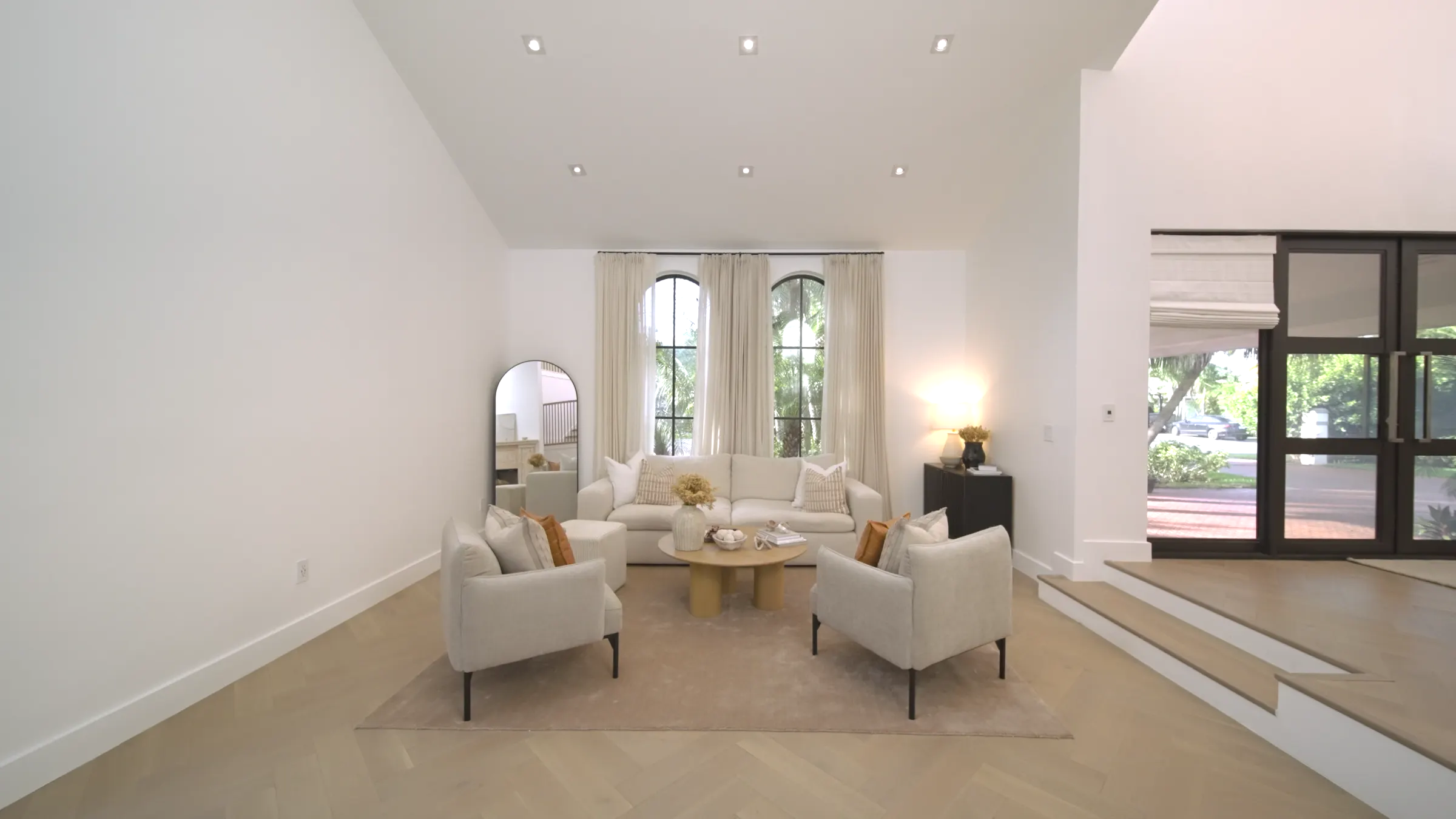 Bright living room with tall windows, ready for its listing photos